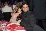 Aishwarya Rai Bachchan and Abhishek Bachchan look loved up at Cannes 2014 amfAR gala evening