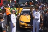Amitabh Bachchan carries Olympic torch in Southwark 