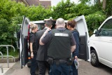 UKBA officials arresting immigration offenders