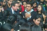 UK PM David Cameron with Bollywood star Aamir Khan and students from Janki Devi College