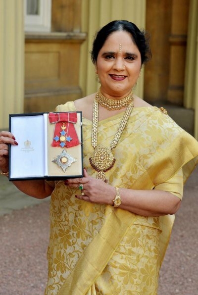Indian-born Asha Khemke, who was awarded Damehood at Buckingham Palace, wore a traditional white and gold silk saree for the ceremony