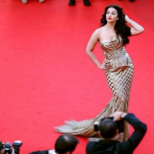 Ash's first red carpet appearance at Cannes 2014 in a Roberto Cavalli gold-hued fish tail gown was a hit