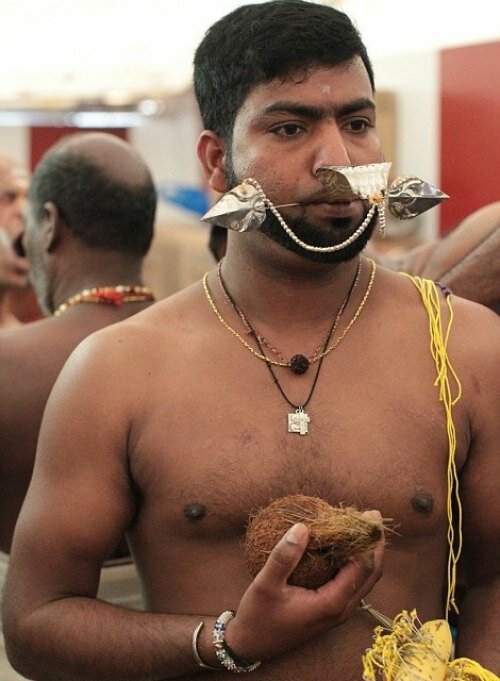 Devotee piercing mouth with spear - Vel - to mark victory of Lord Murugan