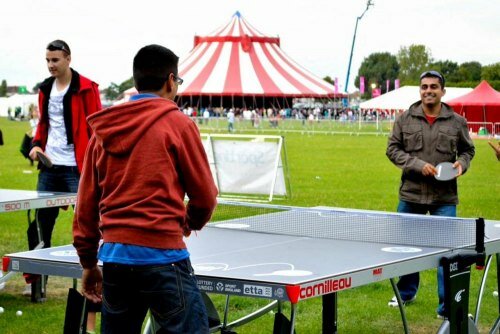 London Mela visitors enjoying a game of table tennis at Gunnersbury park
