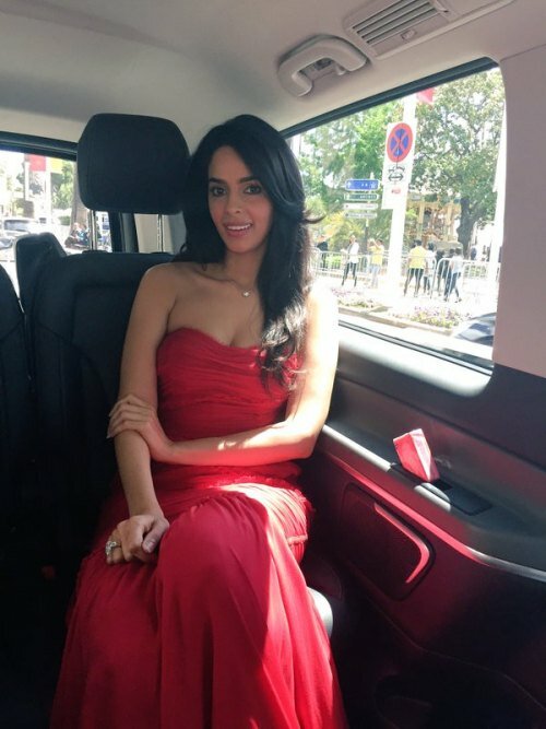Mallika Sherawat in red Dolce and Gabbana for Timeraiders press conference