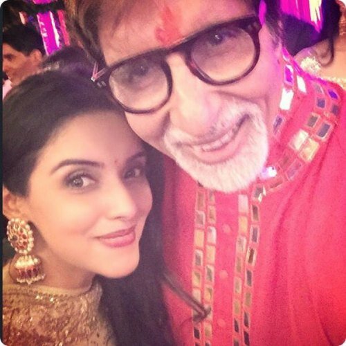 Actress Asin poses for a selfie with host Amitabh Bachchan