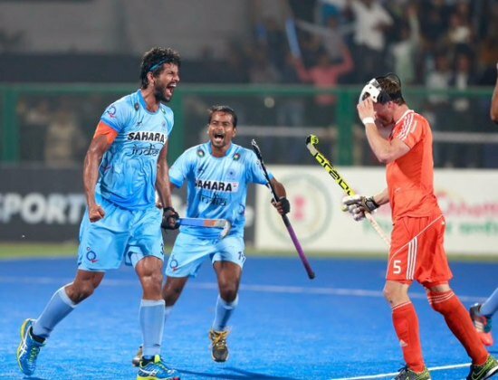 Indian hockey players cheering victory at World Hockey League 2015 in Raipur