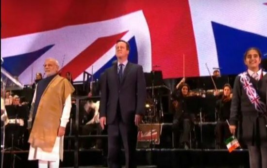 Narendra Modi and David Cameron on stage at Wembley as national anthems of both countries were played