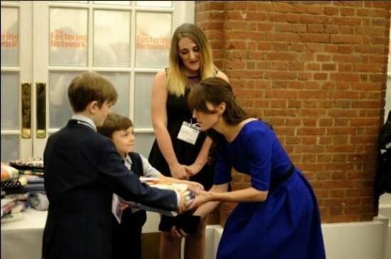 The Duchess interacting with children and receiving presents from them meant for Prince George and Princess Charlotte