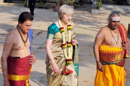 Theresa May chose a mellow gold silk saree for her temple outing